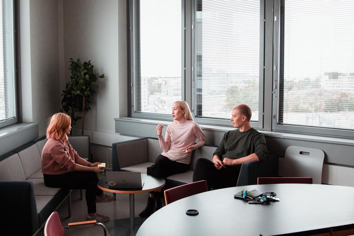 image depicting a person receiving Cognitive Behavioral Therapy, where they are actively engaged in conversation with their therapist, expressing emotions and thoughts.