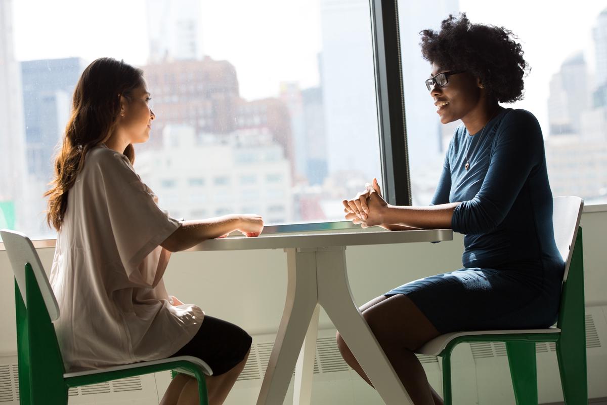 An image depicting different people engaged in conversation, symbolizing the complex process of public opinion formation.