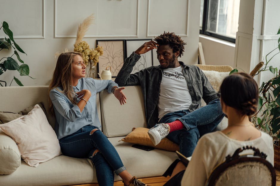 A diverse group of people sitting in a circle during a therapy session, discussing stress management strategies.