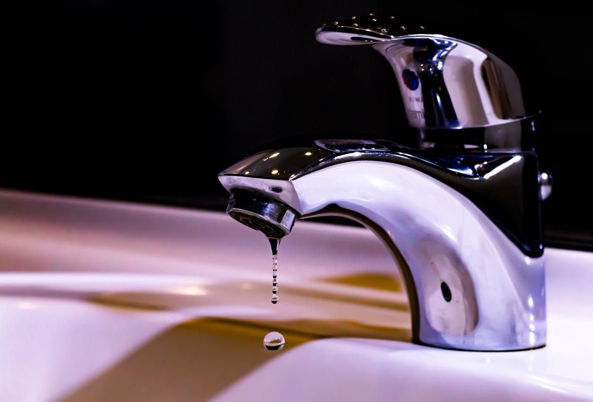 Image depicting chlorinated tap water coming out of a faucet