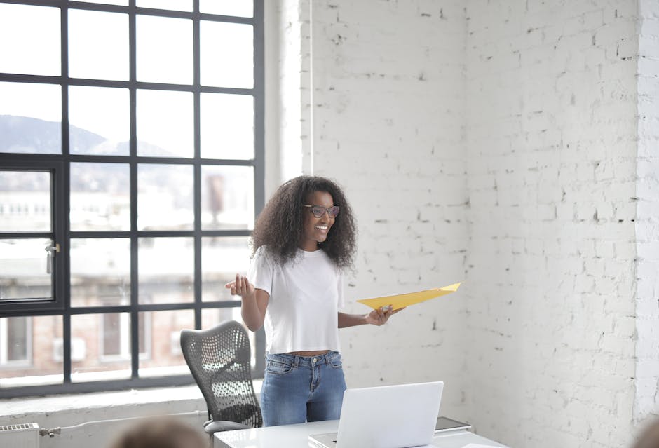 A person speaking confidently in a business meeting, demonstrating effective communication skills.