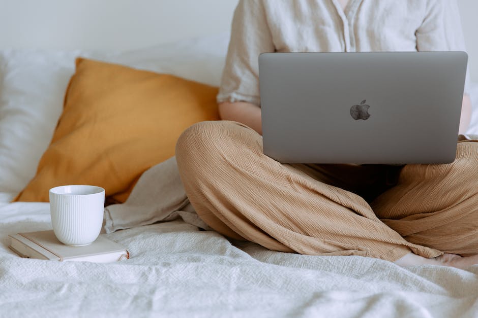 An image showing a person working remotely on a laptop, depicting the connection between remote work and mental health.