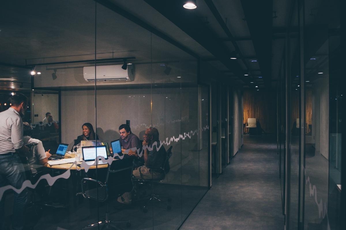 A picture showing a group of diverse employees working together in an office.