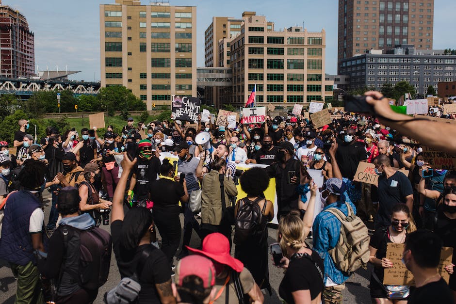 Illustration of a person holding a megaphone and standing out from a crowd, representing the power of personal branding in job market