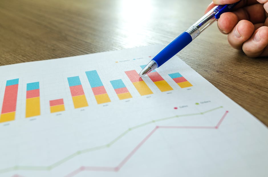 Image depicting a program manager holding a chart and making strategic decisions