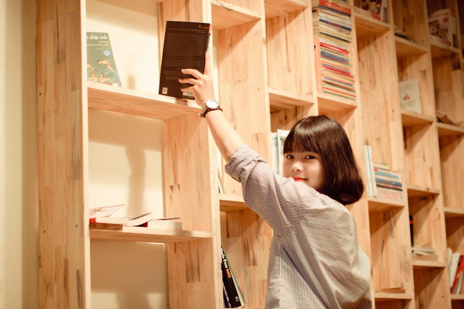 Image of diverse individuals in a library, surrounded by books and technology, symbolizing the importance of public libraries in education and skill development