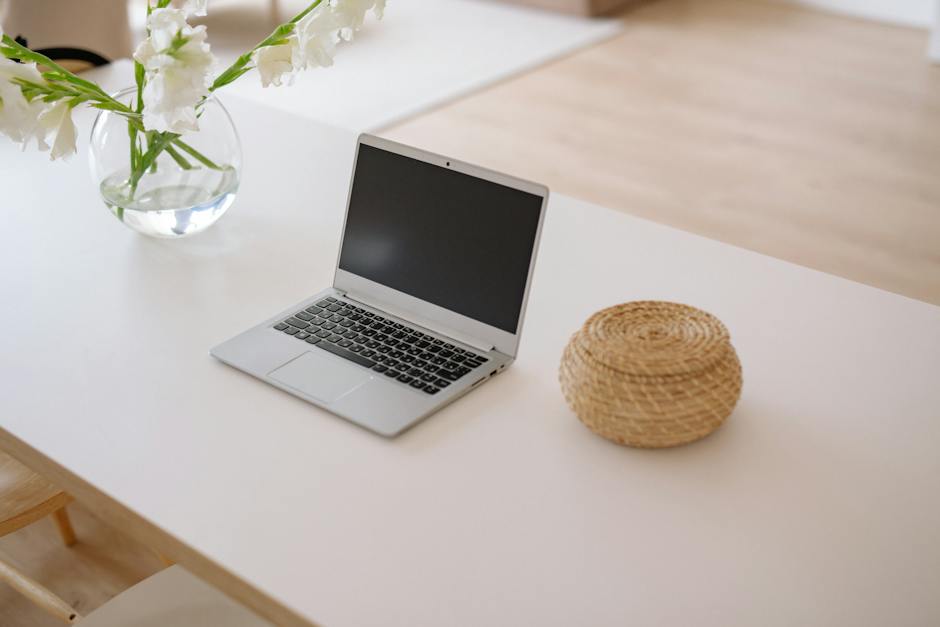 A person sitting at a desk with a laptop, looking thoughtful and concerned, representing the mental health challenges of remote work