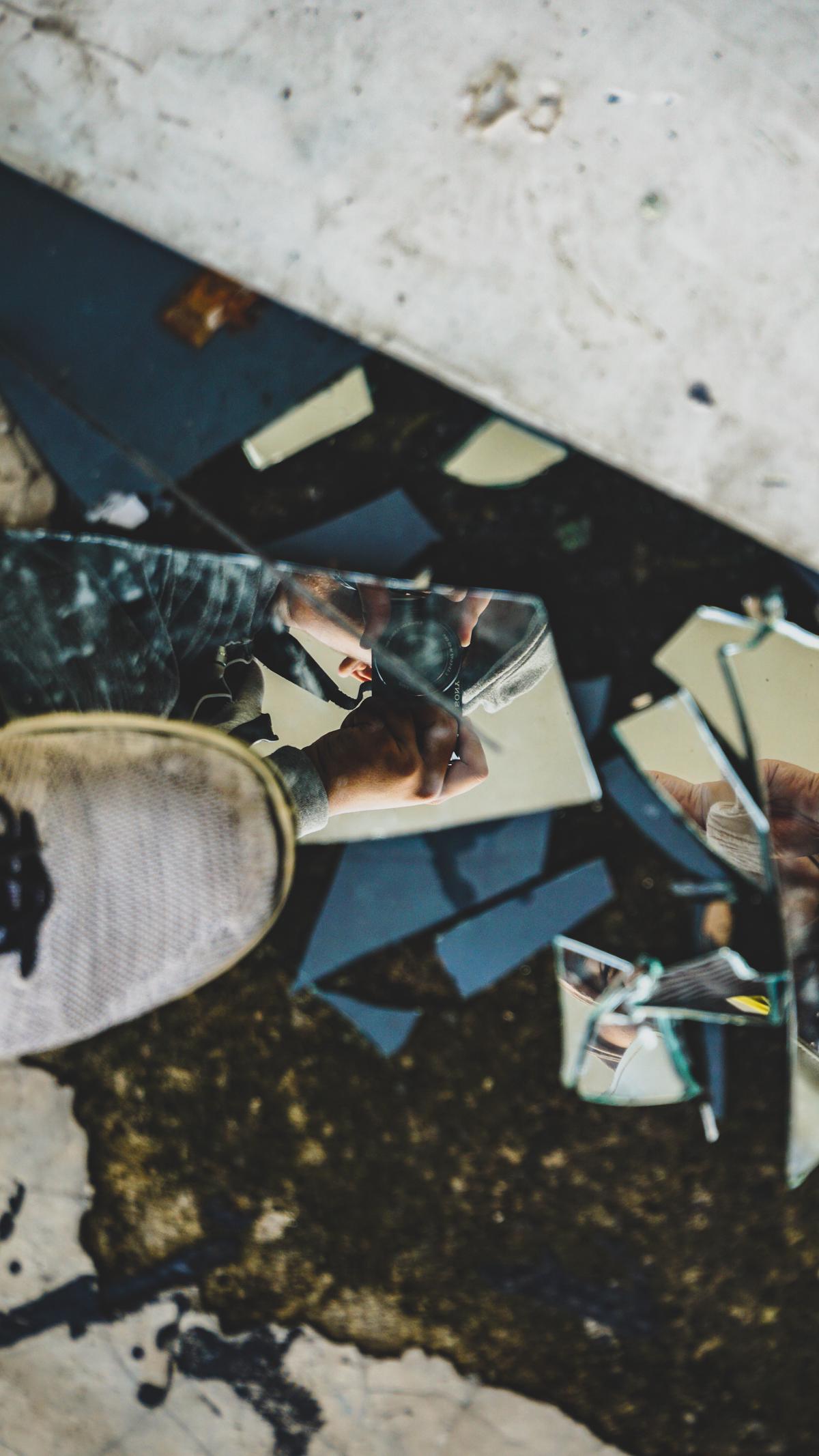 A shattered mirror symbolizing the impact of narcissism on self-esteem and the journey towards healing.