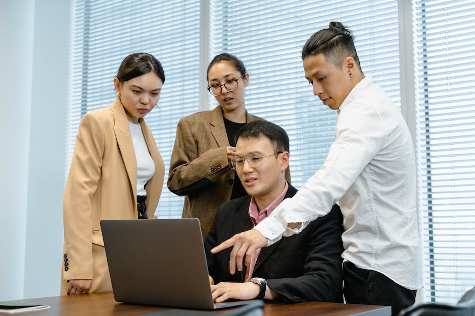 Image depicting professionals collaborating in a traditional office setting