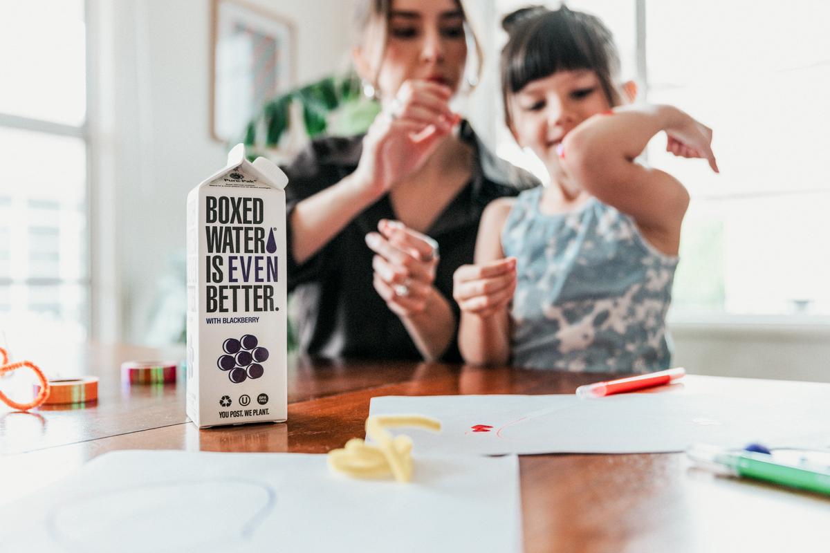 A family enjoying clean drinking water from a water filtration system, emphasizing the importance of safe water for family's health