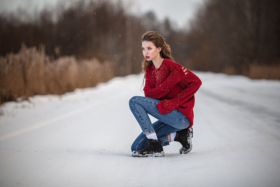 Image of a person wearing stylish winter boots, socks, and accessories, demonstrating fashionable winter footwear choices.